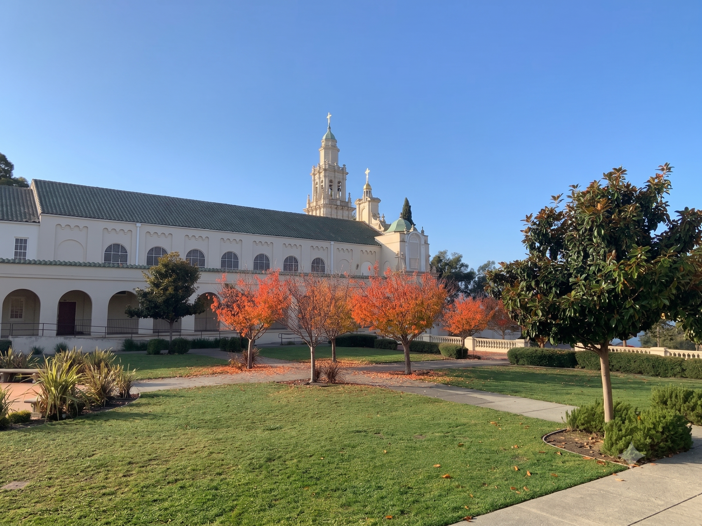 The campus bell tower above the autumn courtyard