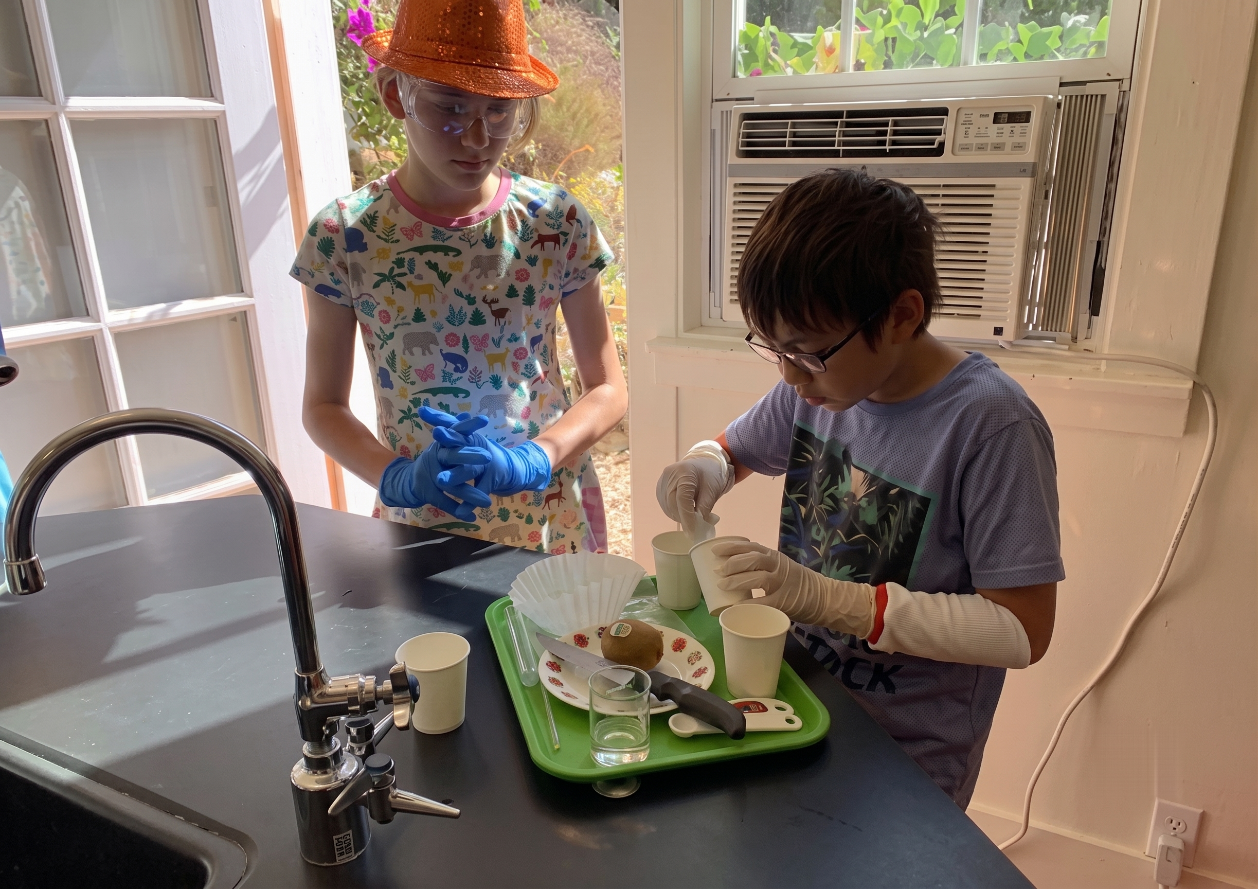 Students in gloves and goggles running a hands-on lab investigation