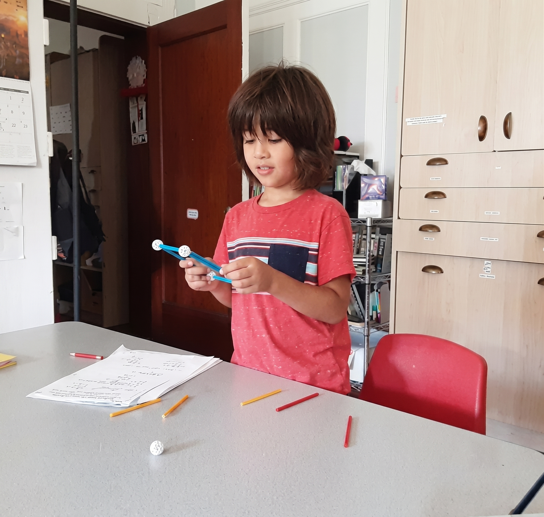 Student building a geometric model during morning math
