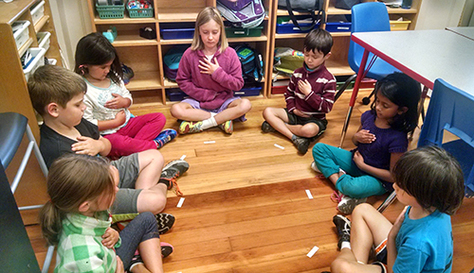 Students sitting in a circle during a mindfulness session